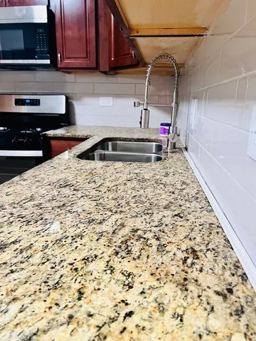 a kitchen with a sink and cabinets