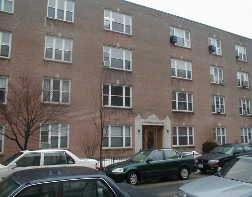 84 Strathmore Road, Unit 7 84 Boston, MA 02135 - Photo 1 of 1 a front view of a house with car parked