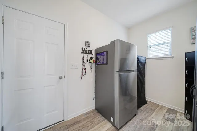 a refrigerator freezer sitting inside of a kitchen