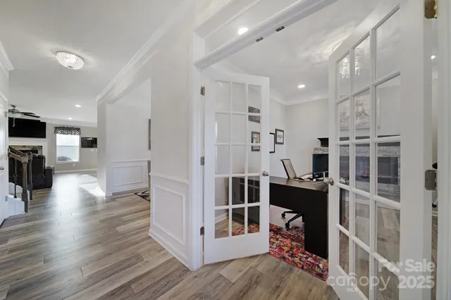 a view of living room with furniture and flat screen tv