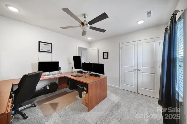 a room with furniture and a flat screen tv