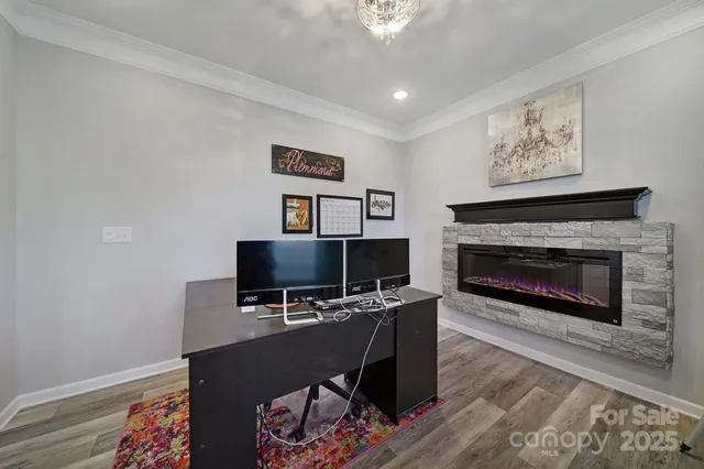 a view of a livingroom with furniture and a fireplace