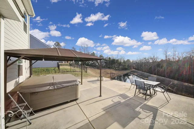 a view of a balcony with table and chairs