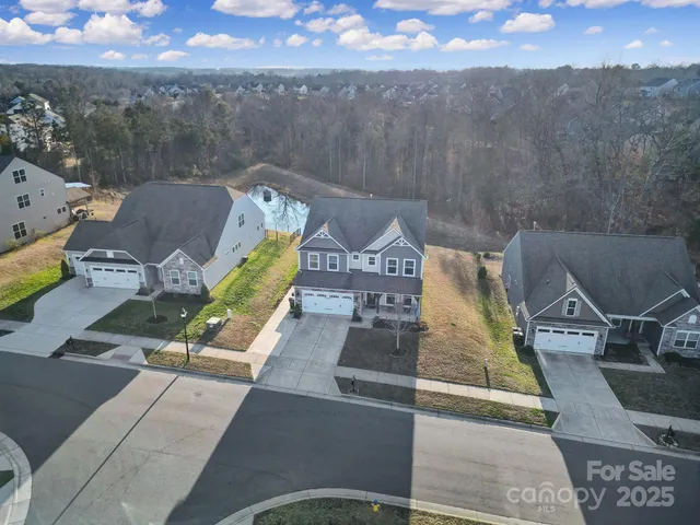 an aerial view of a house with a garden