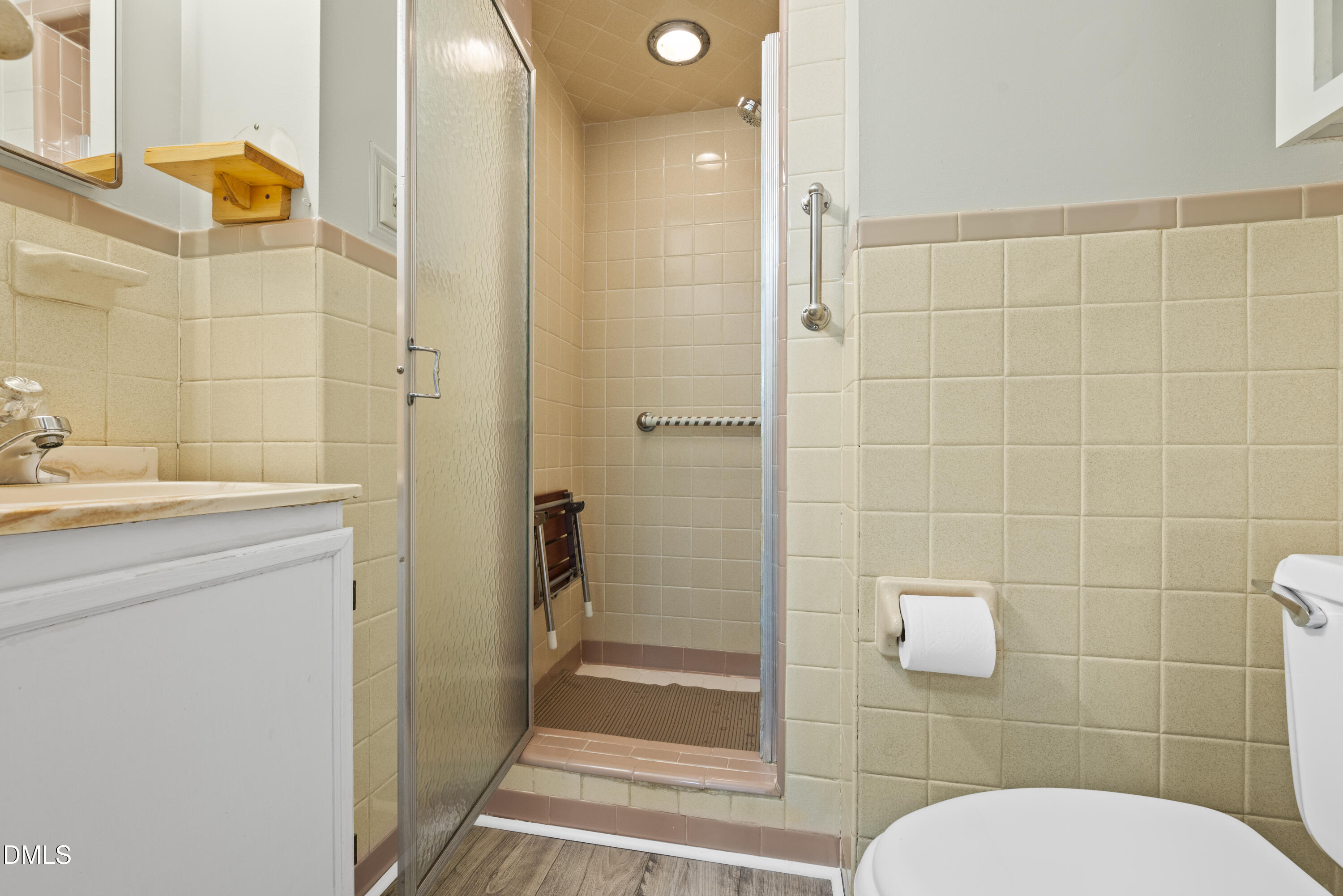 518 Goodwin Road Durham, NC 27712 - Photo 15 of 38 a bathroom with a granite countertop sink toilet and shower