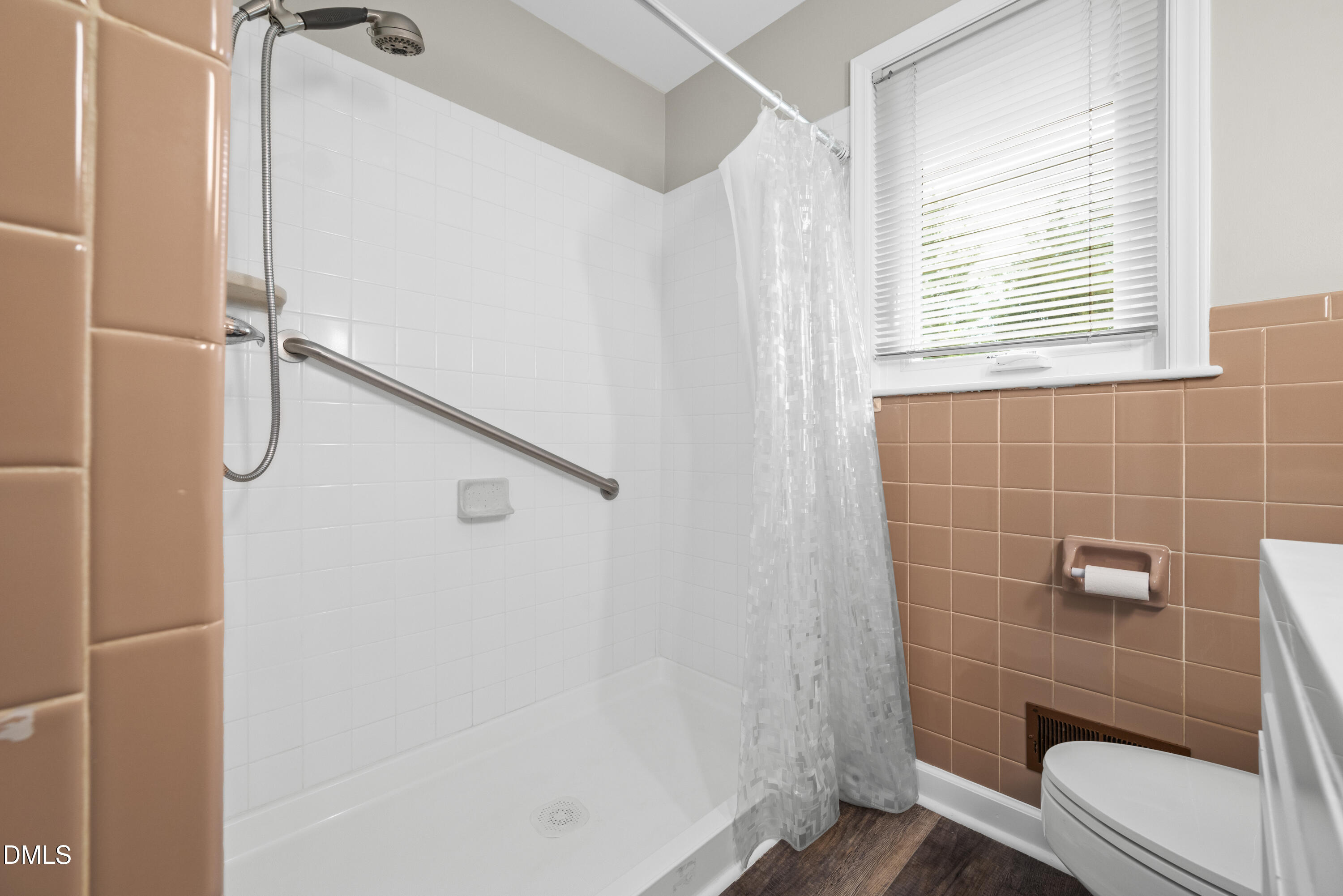 518 Goodwin Road Durham, NC 27712 - Photo 21 of 38 a bathroom with a shower and a toilet