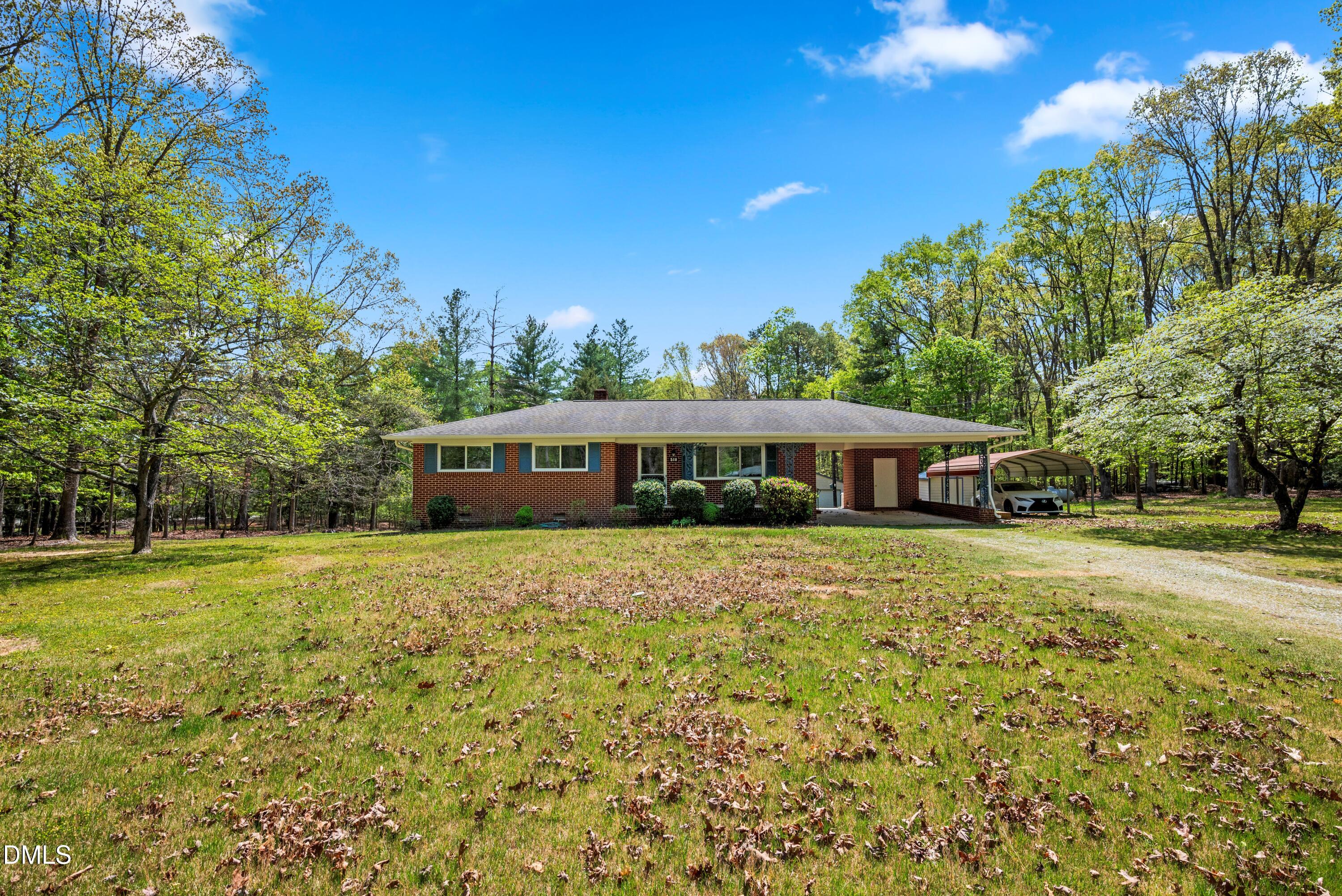 518 Goodwin Road Durham, NC 27712 - Photo 35 of 38 a front view of a house with a garden