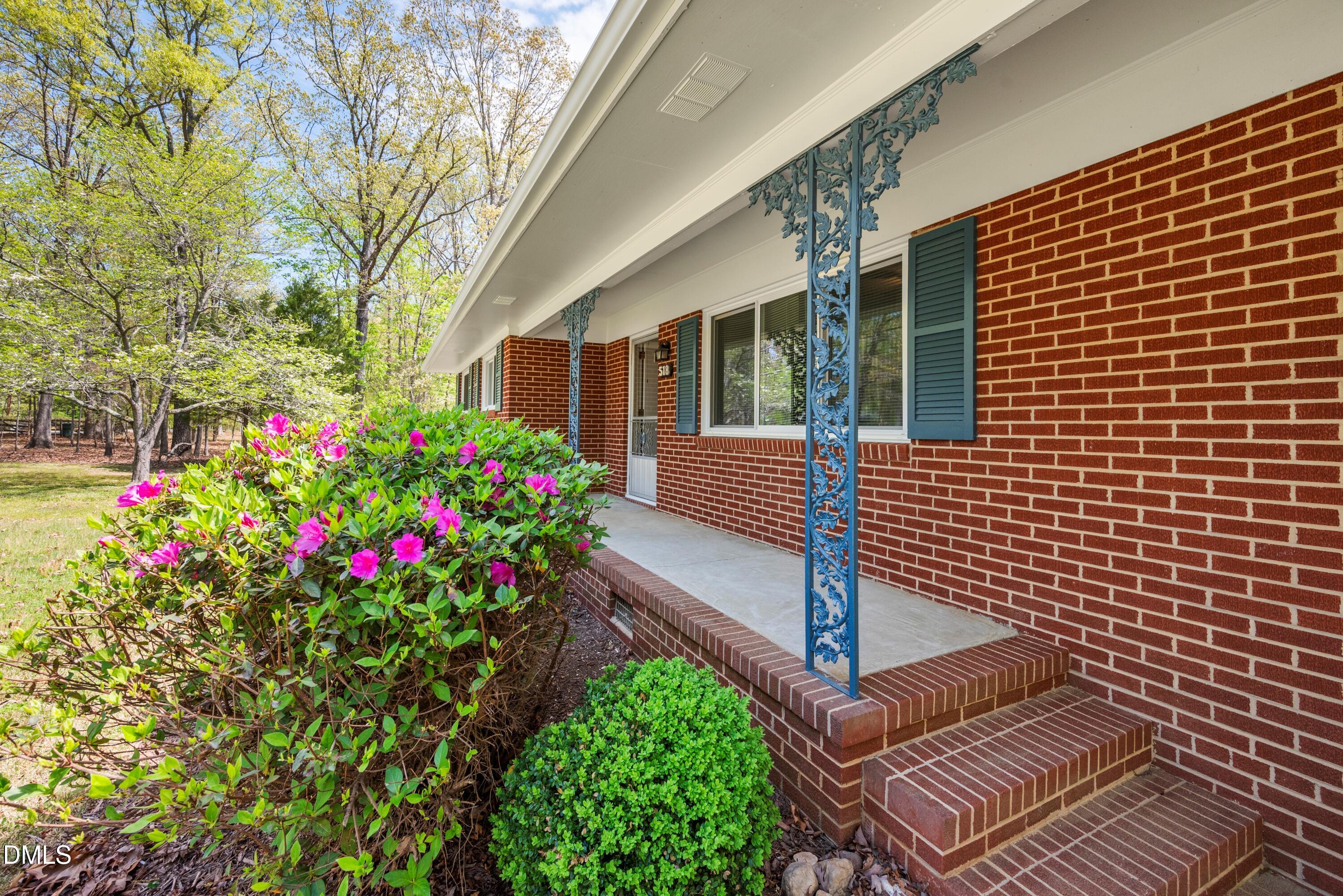 518 Goodwin Road Durham, NC 27712 - Photo 36 of 38 a front view of a house with a garden