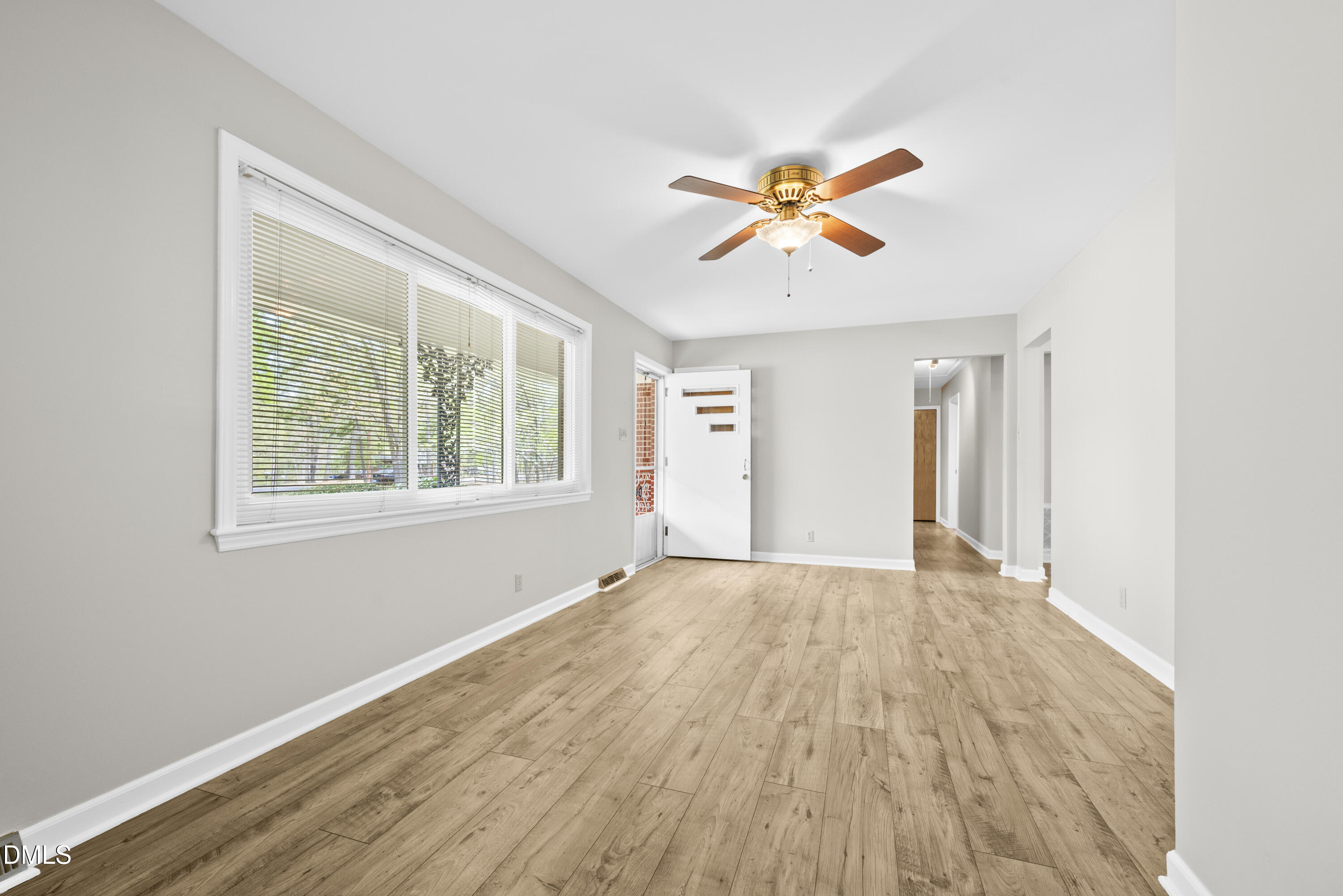 518 Goodwin Road Durham, NC 27712 - Photo 4 of 38 a view of a room with a window and wooden floor