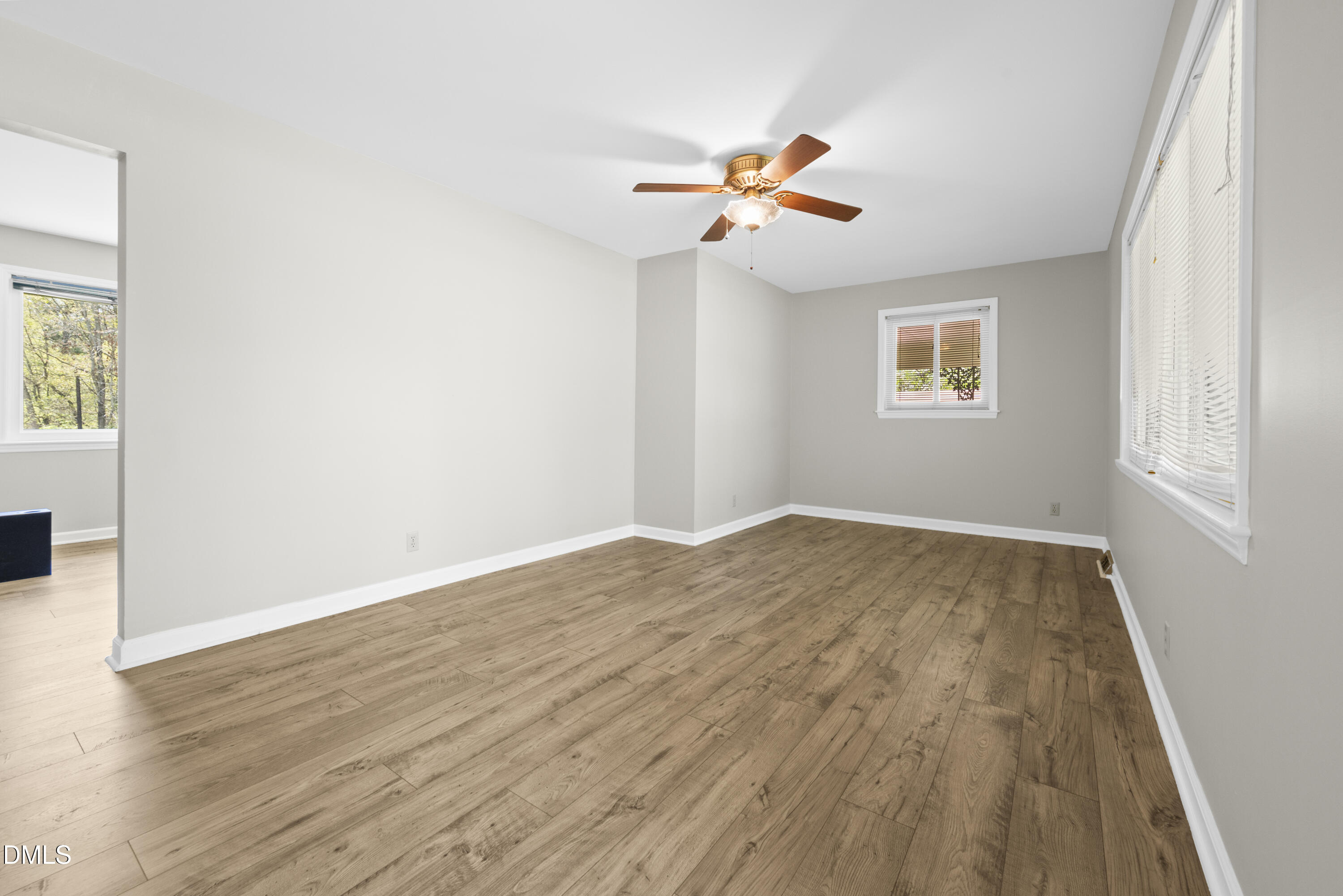 518 Goodwin Road Durham, NC 27712 - Photo 5 of 38 a view of empty room with wooden floor and fan