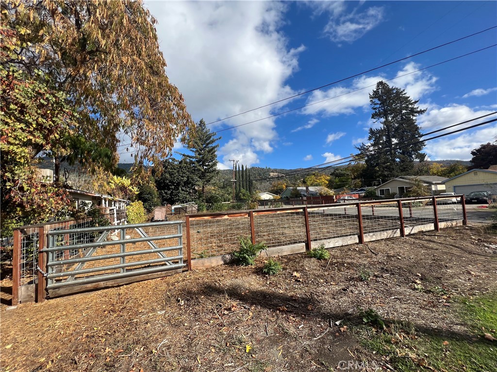 4410 Bush Street Lucerne, CA 95458 - Photo 2 of 5 a view of a yard with wooden fence