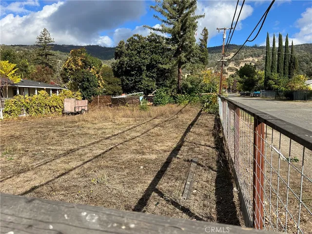 a view of balcony with wooden floor and outdoor space