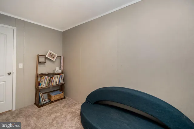 a room with a bed and a mirror