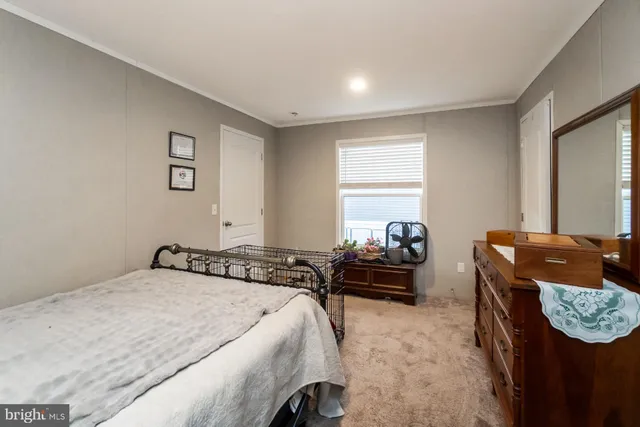 a bedroom with a bed and couch