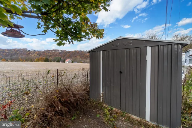 a view of a wooden fence next to a yard