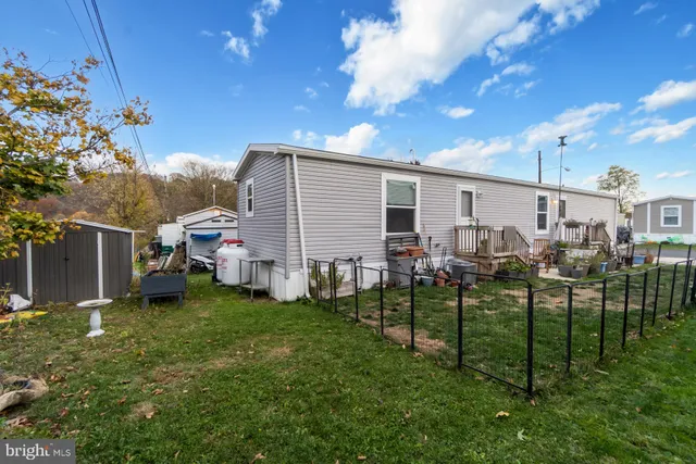 a view of a backyard with a garden and plants