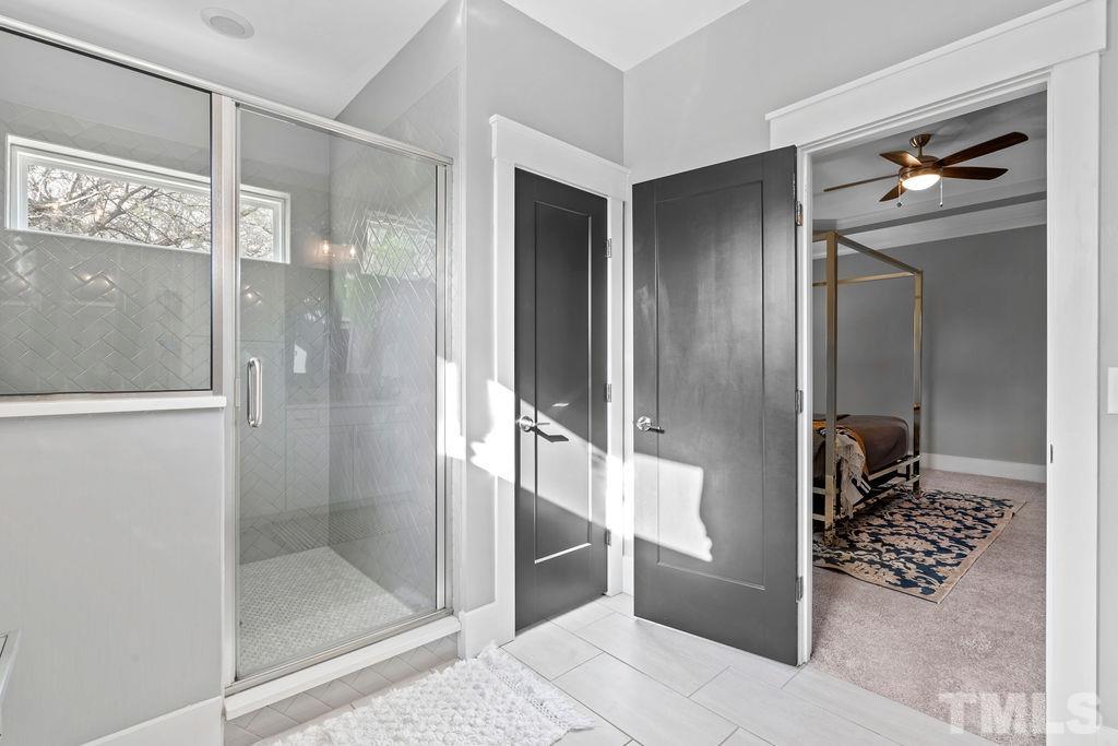 607 Bragg Street Raleigh, NC 27610 - Photo 26 of 44 a bathroom with a shower and a mirror