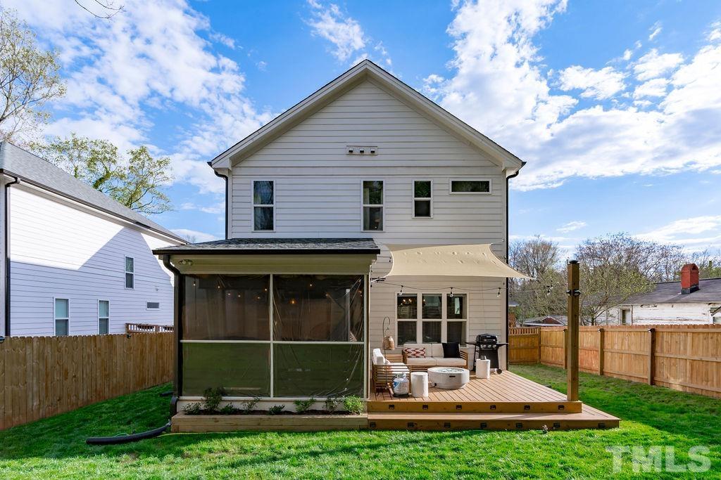 607 Bragg Street Raleigh, NC 27610 - Photo 36 of 44 a view of a house with a yard and sitting area