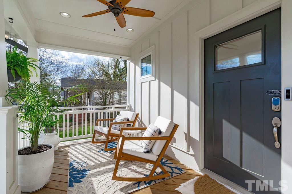 607 Bragg Street Raleigh, NC 27610 - Photo 6 of 44 a view of a porch with furniture and a yard