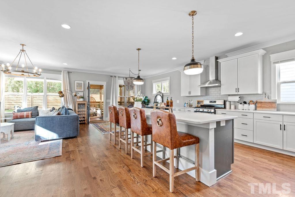 607 Bragg Street Raleigh, NC 27610 - Photo 10 of 44 a large kitchen with a table and chairs