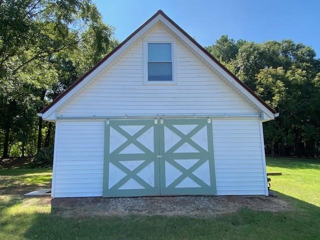 5919 River Road Flowery Branch, GA 30542 - Photo 5 of 18 a view of front of house with a yard