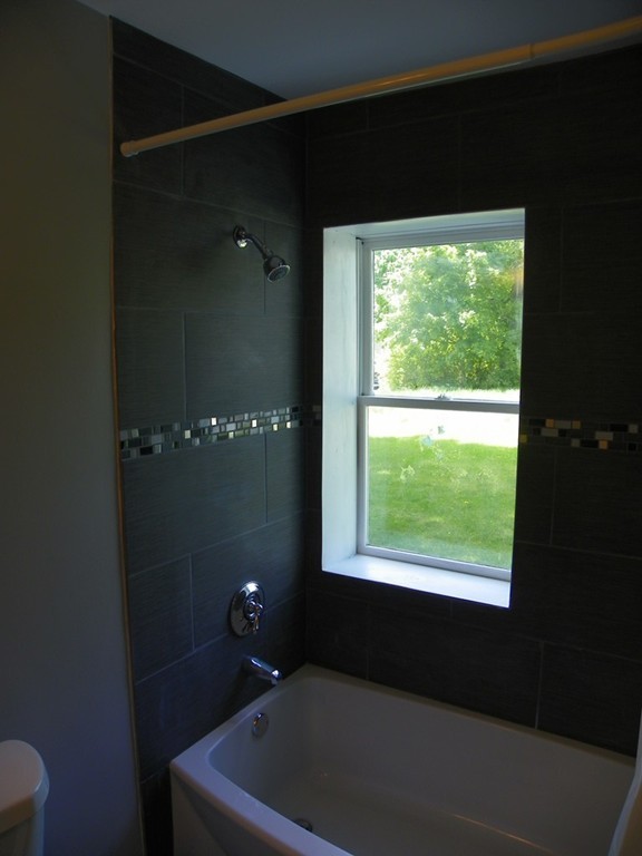 4 Gardner Road Hubbardston, MA 01452 - Photo 15 of 22 a bathroom with a bathtub and shower