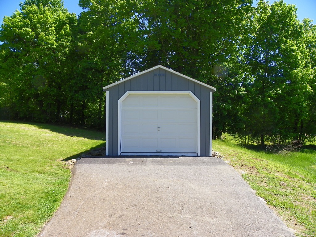 4 Gardner Road Hubbardston, MA 01452 - Photo 18 of 22 a house with green field in front of it