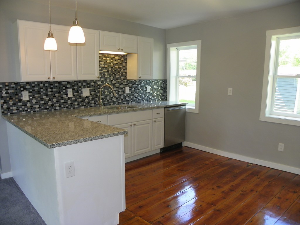4 Gardner Road Hubbardston, MA 01452 - Photo 5 of 22 a kitchen with a sink and chandelier