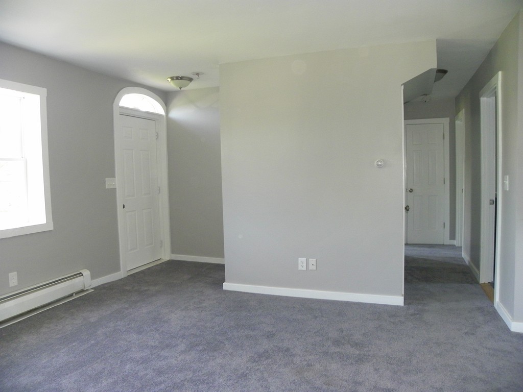 4 Gardner Road Hubbardston, MA 01452 - Photo 9 of 22 an empty room with closet and mirror