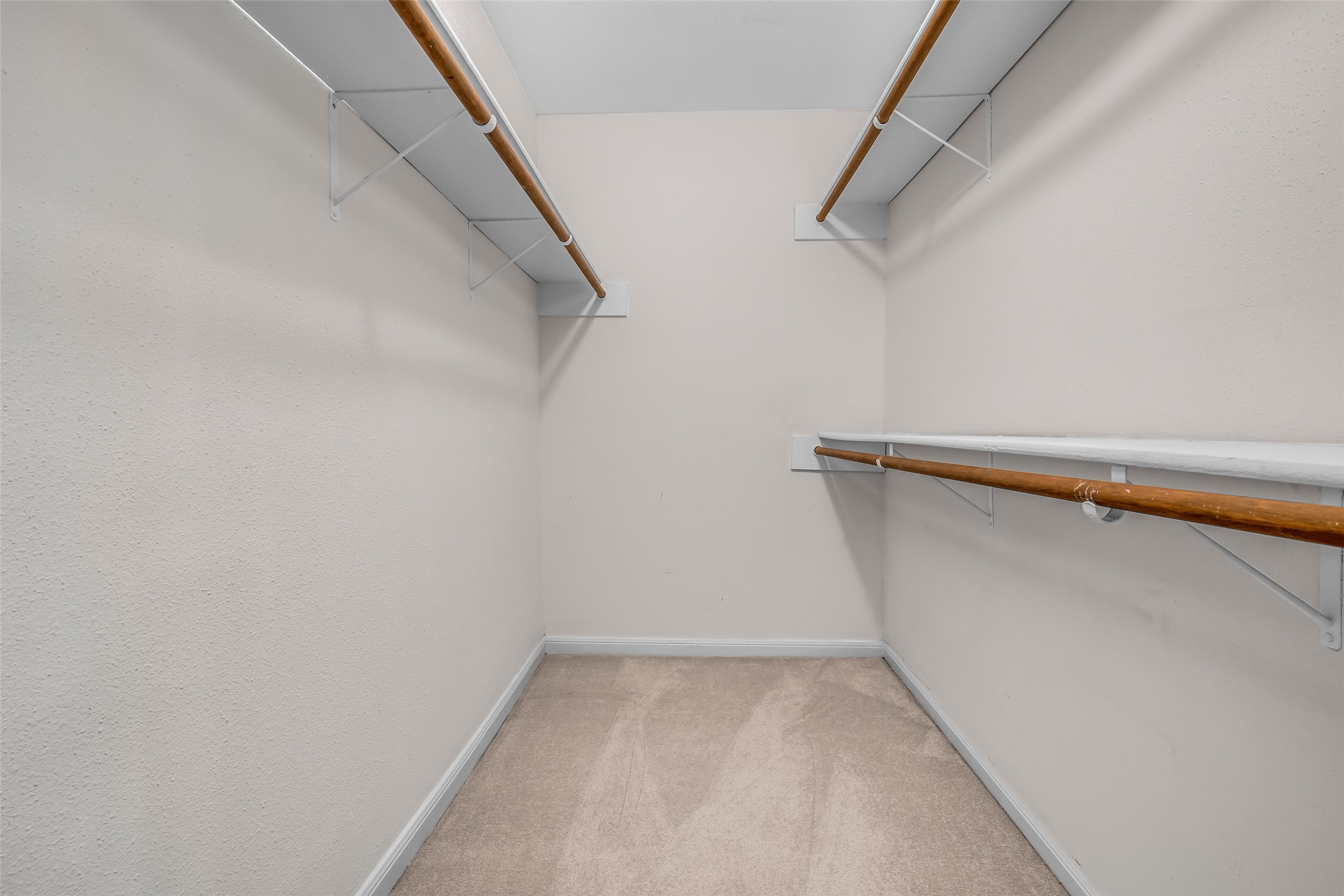 7485 Brompton Street, Unit 7485 Houston, TX 77025 - Photo 36 of 43 Spacious walk-in closet with ample shelving and hanging space in the upstairs third bedroom.