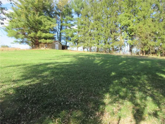 a fire hydrant in the middle of a field
