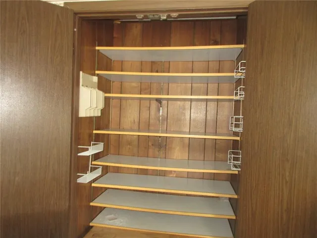 a view of a room with racks on the wall