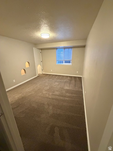 1563 South 600 East Springville, UT 84663 - Photo 23 of 30 Carpeted room featuring a single window with blinds, three wall niches, and a flush-mount ceiling light fixture