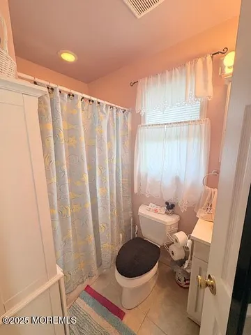 a bathroom with a sink and a shower curtain