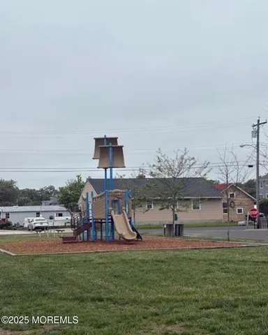 a view of a swimming pool and a yard