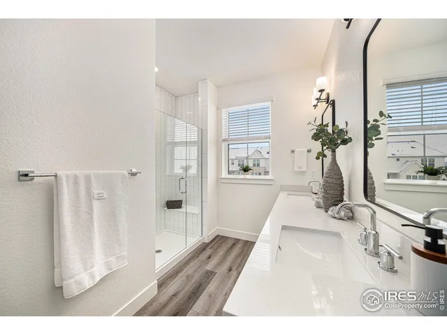 a living room with furniture and a large mirror