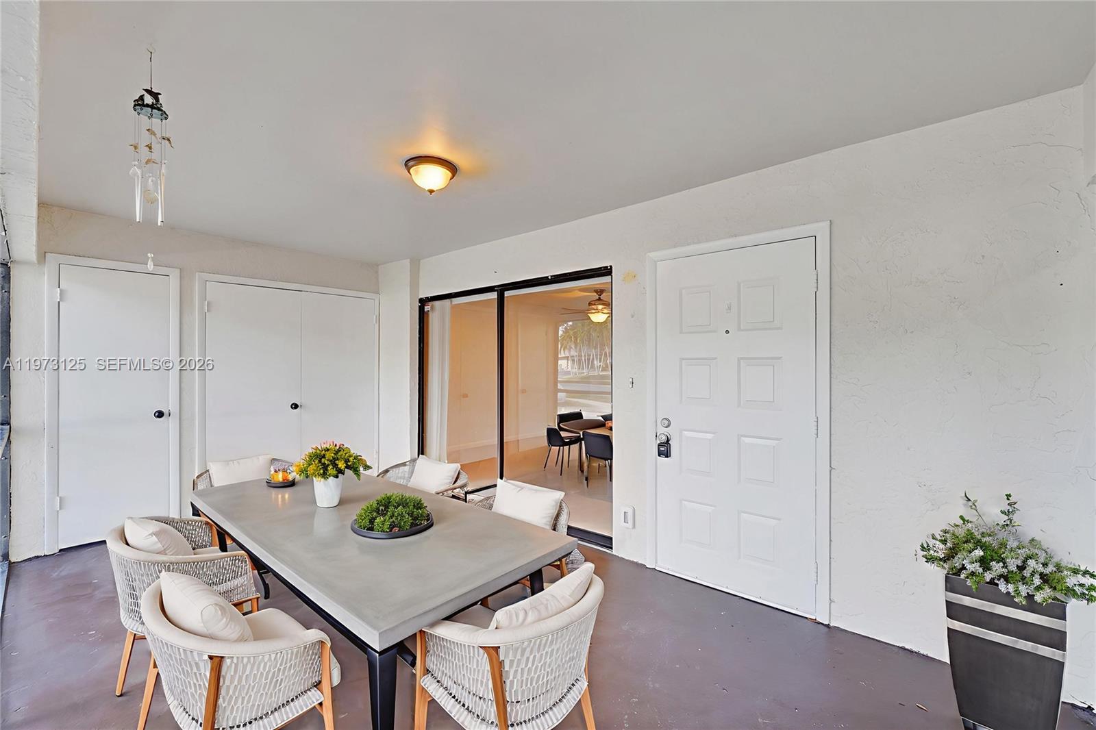 9340 Southwest 61st Way, Unit B Boca Raton, FL 33428 - Photo 18 of 25 a view of a dining room with furniture and window