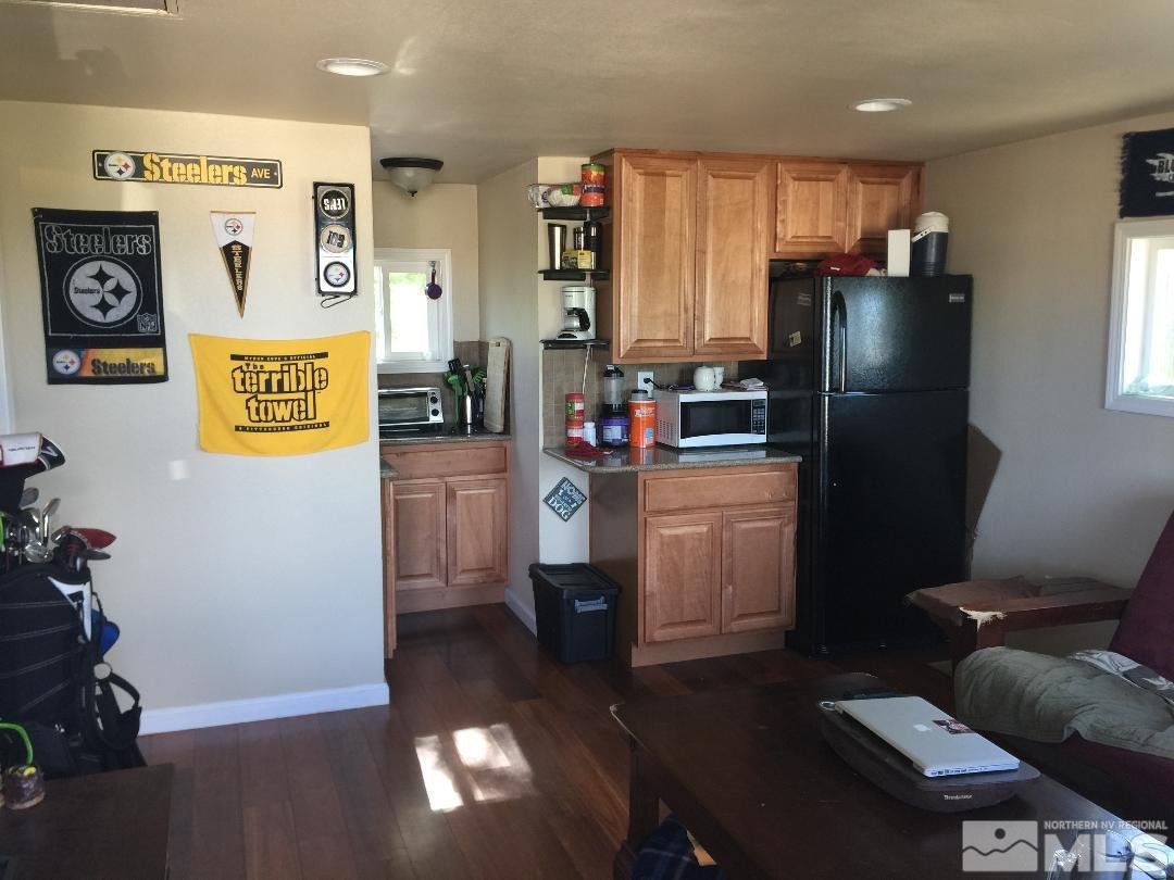 1333 Terrace Drive Reno, NV 89503 - Photo 11 of 21 a kitchen with a refrigerator and a stove top oven