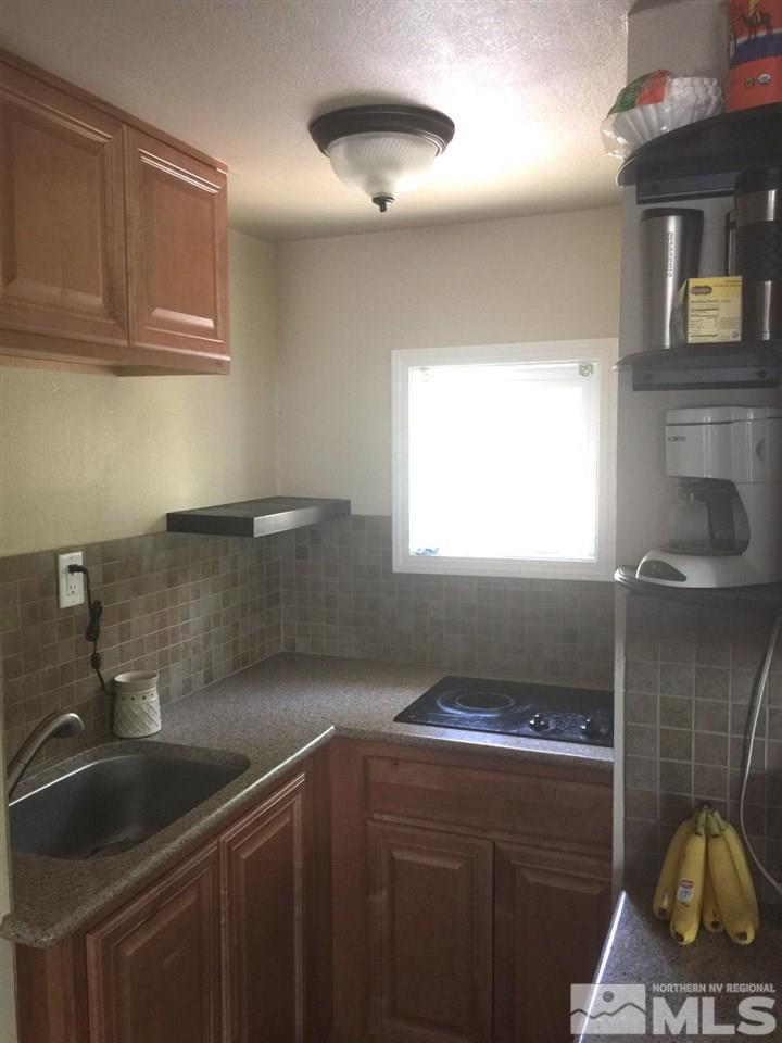 1333 Terrace Drive Reno, NV 89503 - Photo 13 of 21 a kitchen with granite countertop a sink and a stove