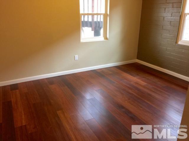 1333 Terrace Drive Reno, NV 89503 - Photo 4 of 21 a view of an empty room with wooden floor and a window