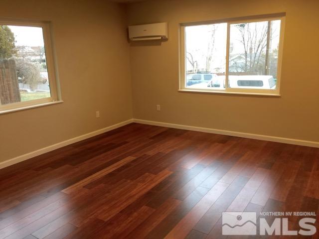 1333 Terrace Drive Reno, NV 89503 - Photo 7 of 21 an empty room with wooden floor and windows