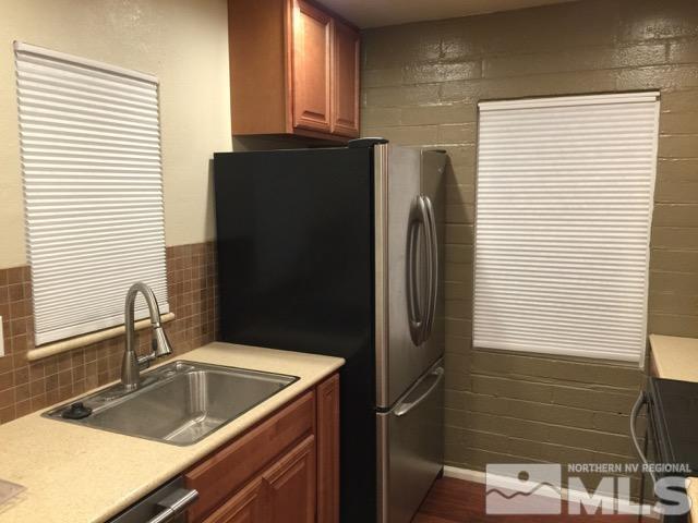 1333 Terrace Drive Reno, NV 89503 - Photo 8 of 21 a kitchen with a refrigerator and a sink
