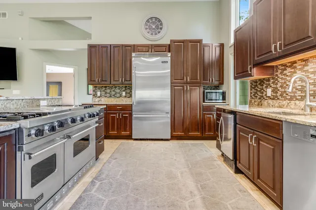 a bed room with a bed and a chair