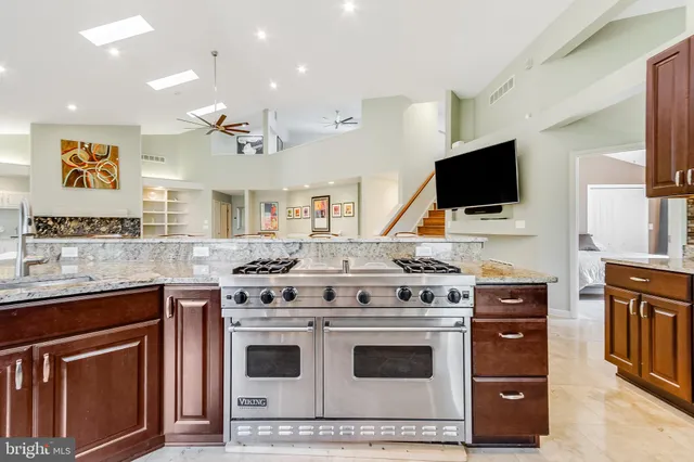 a bedroom with a bed and a ceiling fan