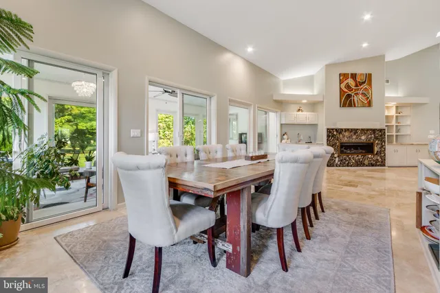 a spacious bedroom with a bed and a chandelier