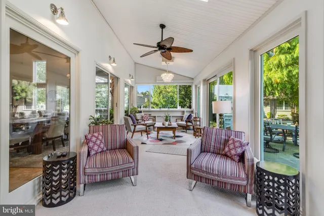 a kitchen with cabinets and a refrigerator