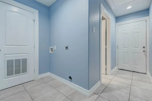 a view of an empty room with closet and mirror