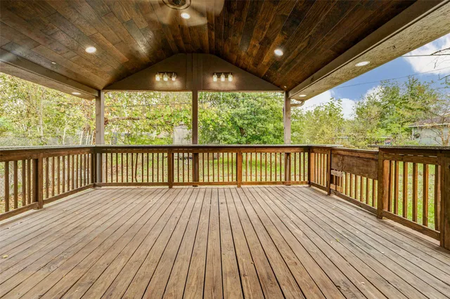 a view of porch with wooden floor