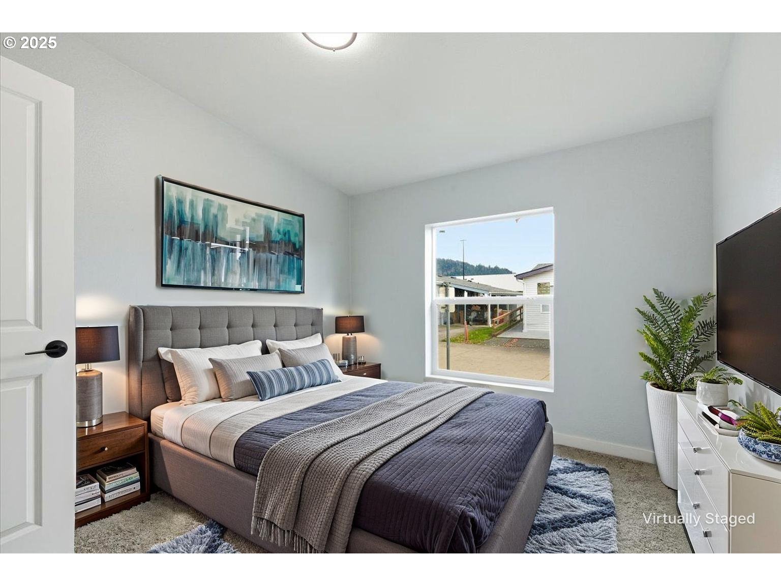 200 Market Street, Unit 255 Lebanon, OR 97355 - Photo 18 of 35 a bedroom with a large bed and a flat screen tv