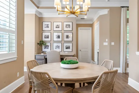 a view of a dining room with furniture and window